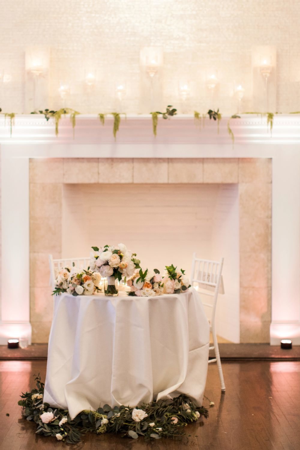 Modern spring wedding at Belle Mer in sweetheart table at Belle Mer in Newport RI with yellow, ivory and blush