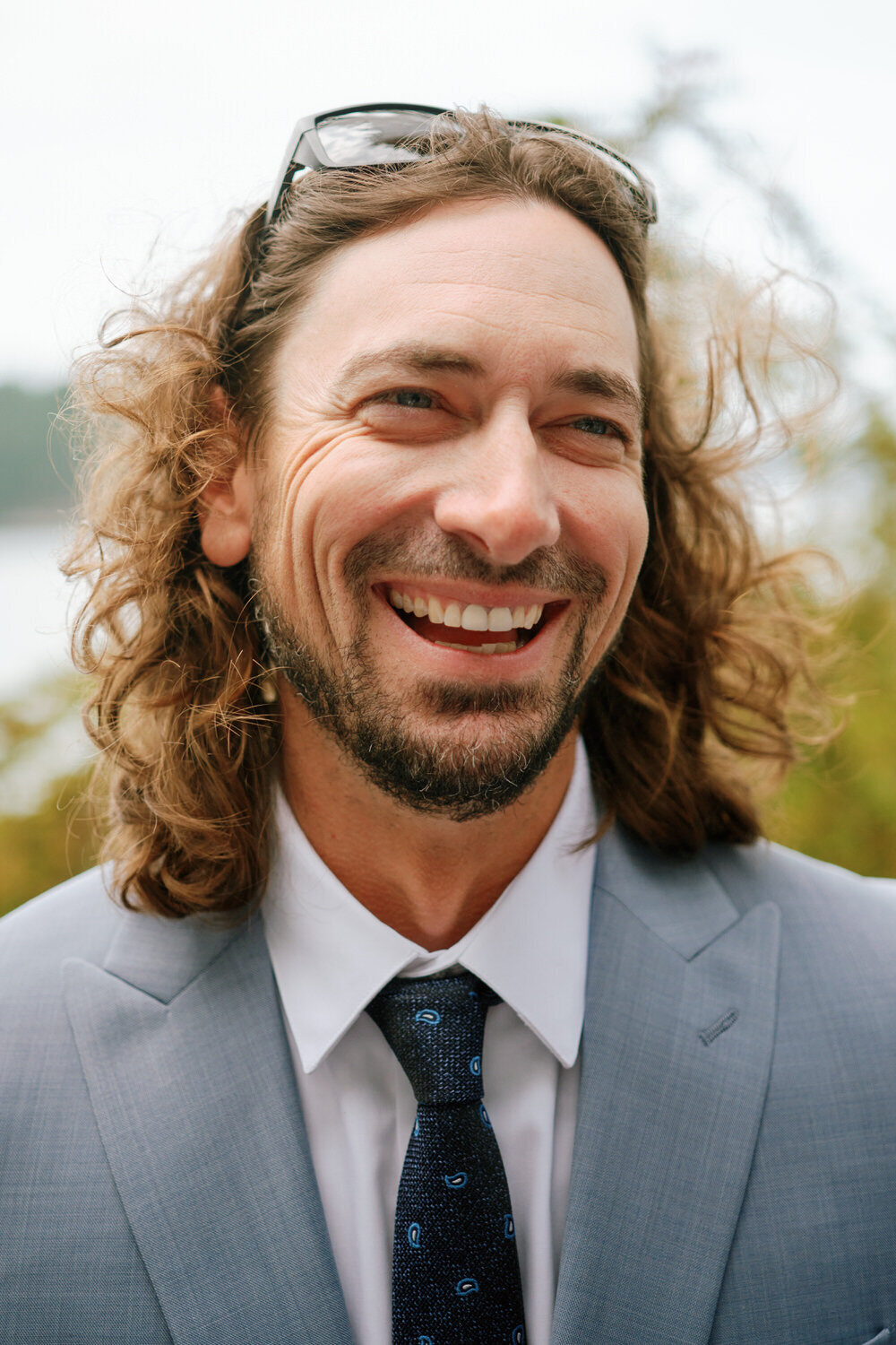 Portrait of a groomsman laughing