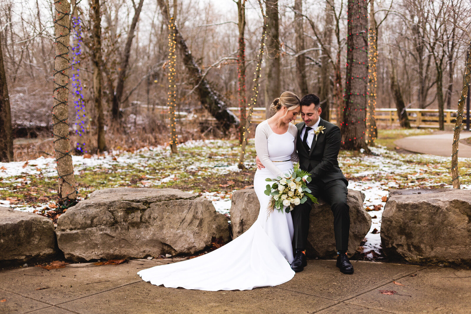bride and groom snuggling for winter wedding portraits ohio