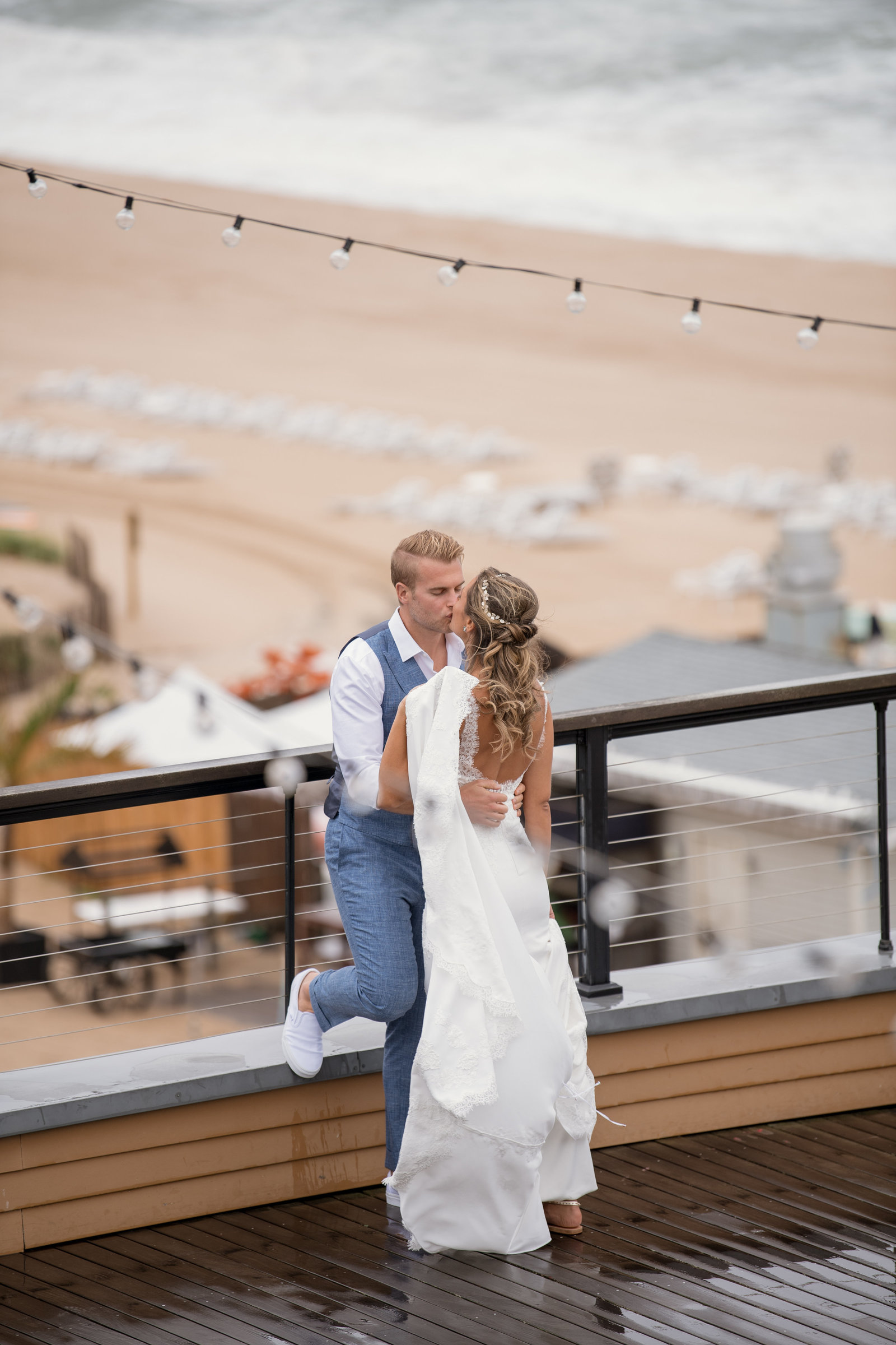 photo of bride and groom on the outside deck at Gurneys Montauk Resort wedding