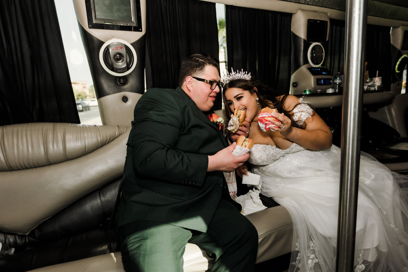 Bride & Groom share some In n Out in the Party Bus