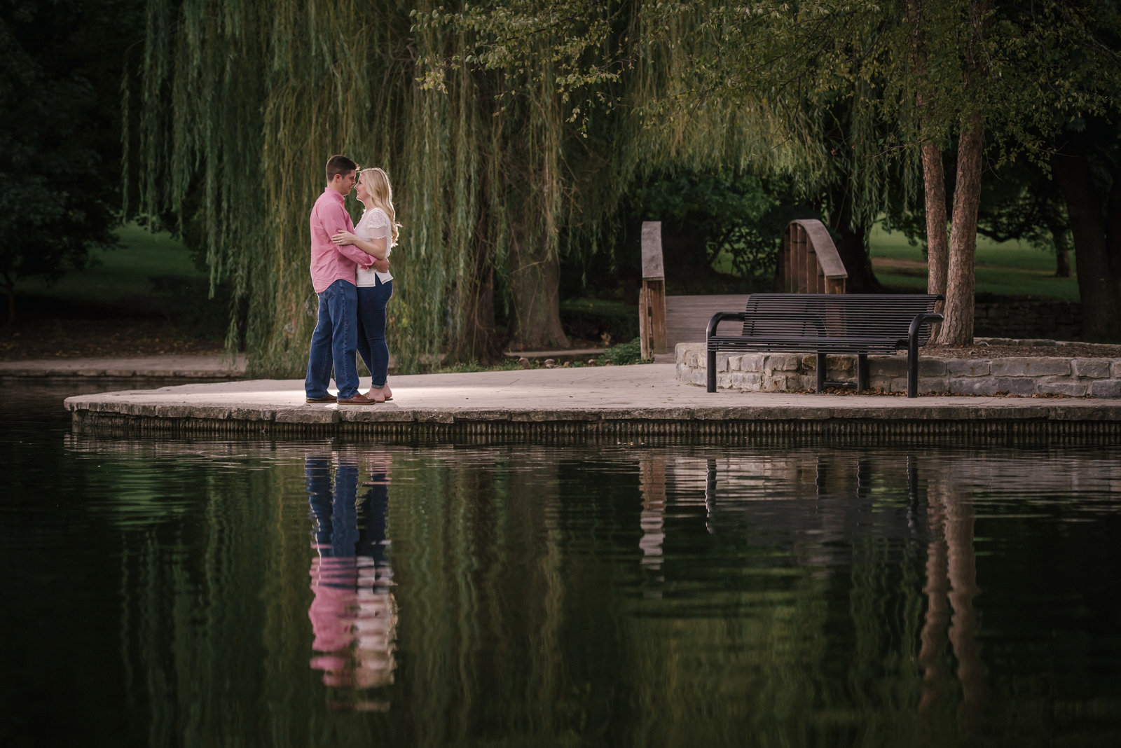 couple kissing by water in Kansas City