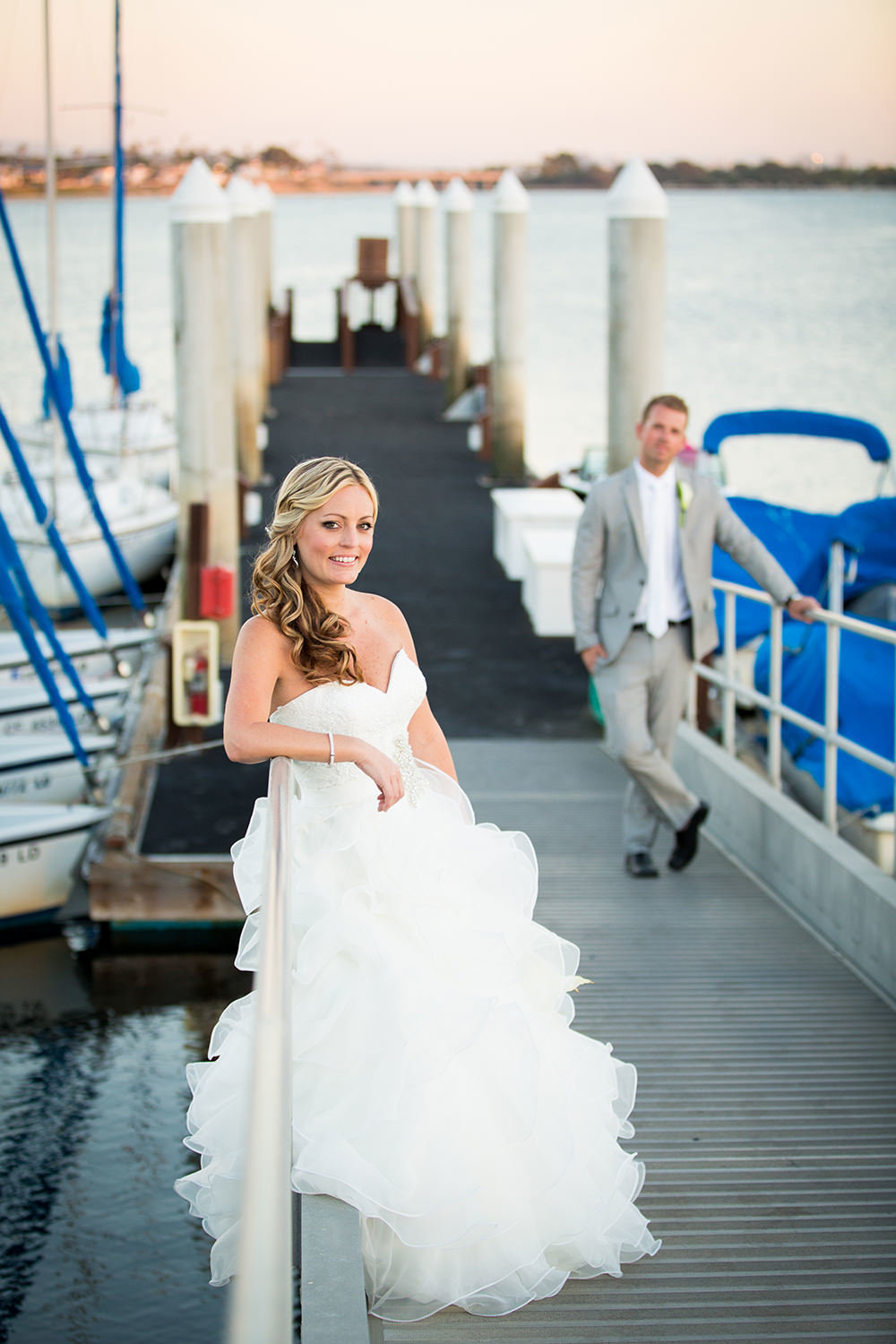 cute bride on dock with groom