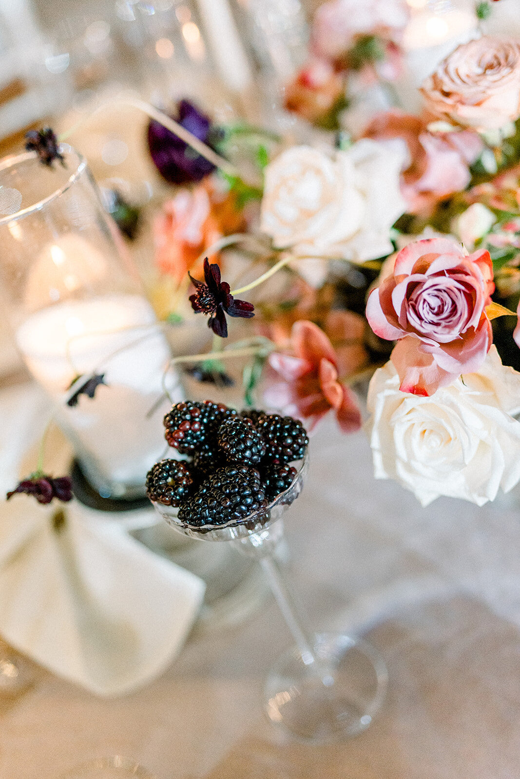 Editorial wedding photography of lush floral arrangement with blush roses and vintage styling, perfect for Los Angeles weddings.