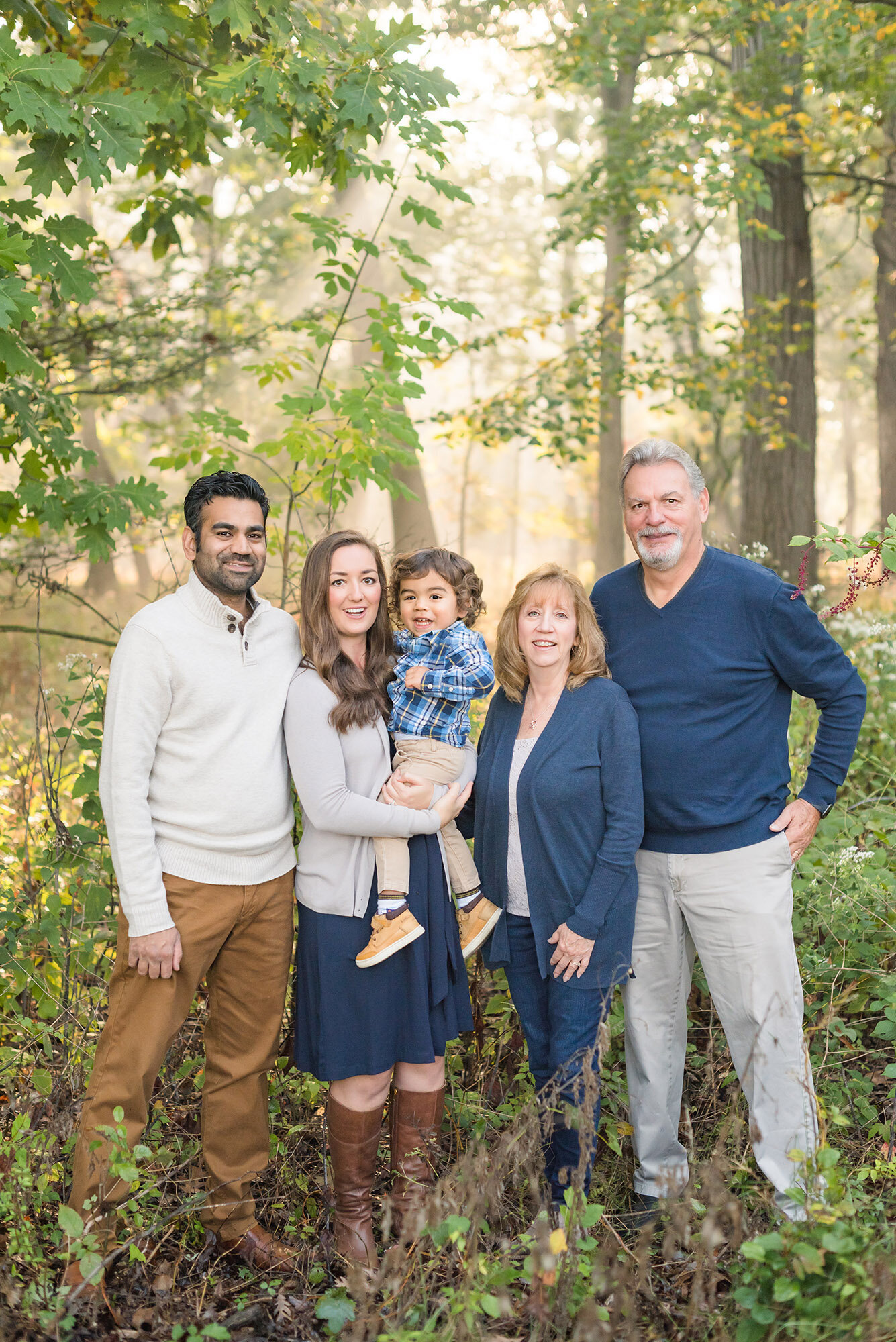 Family photos with grandparents in the fall woods