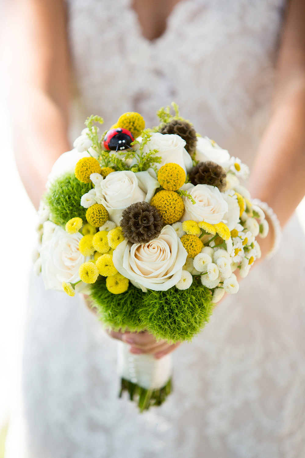 beautiful bouquet with greens yellows and white