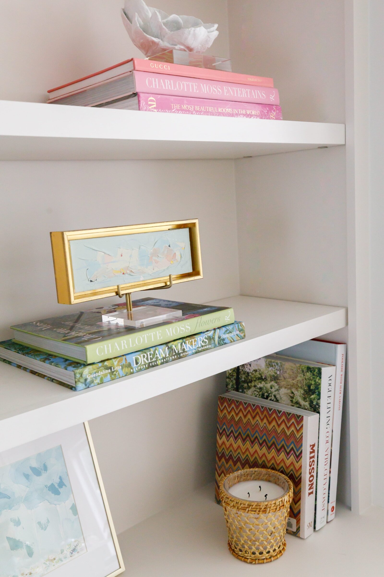 vision and hammer styling shelf with books and gold frame