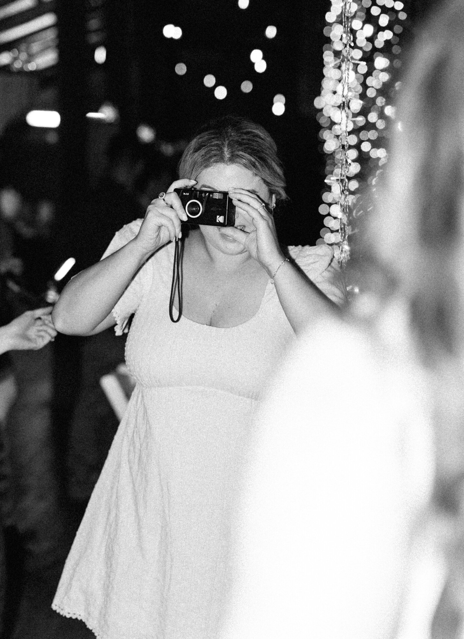 girl taking film photo