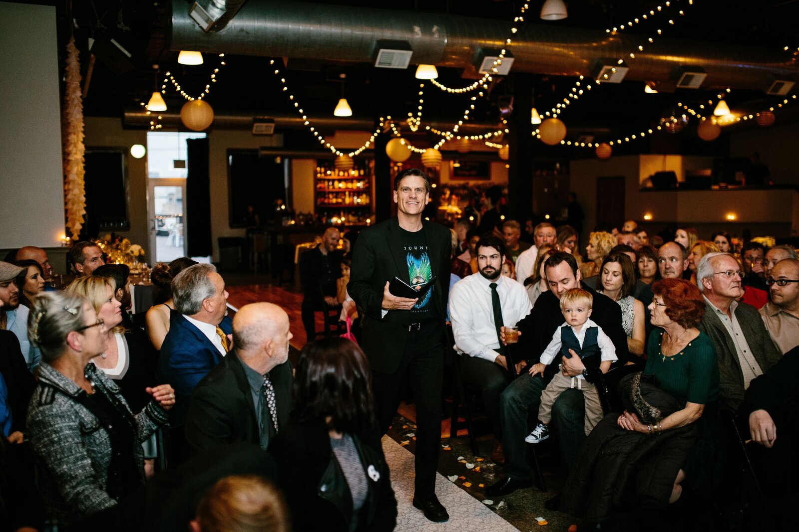 Wedding officiant walks down aisle to prepare to lead a wedding ceremony