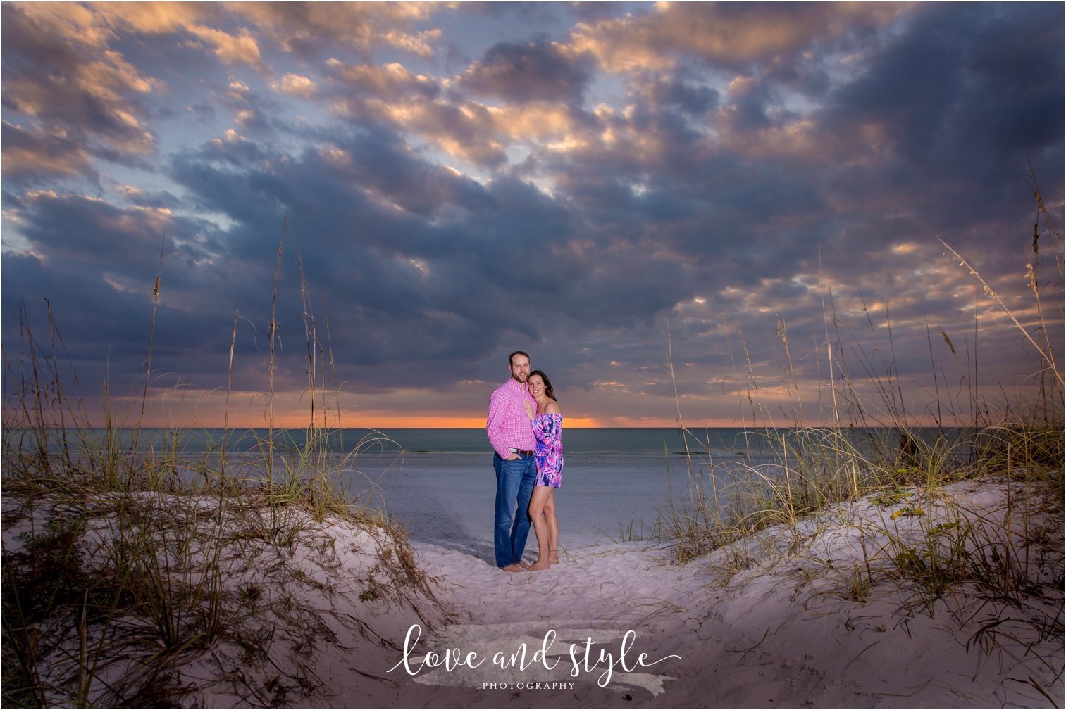 Anna Maria Island Engagement Photography of couple at sunset between sand dunes