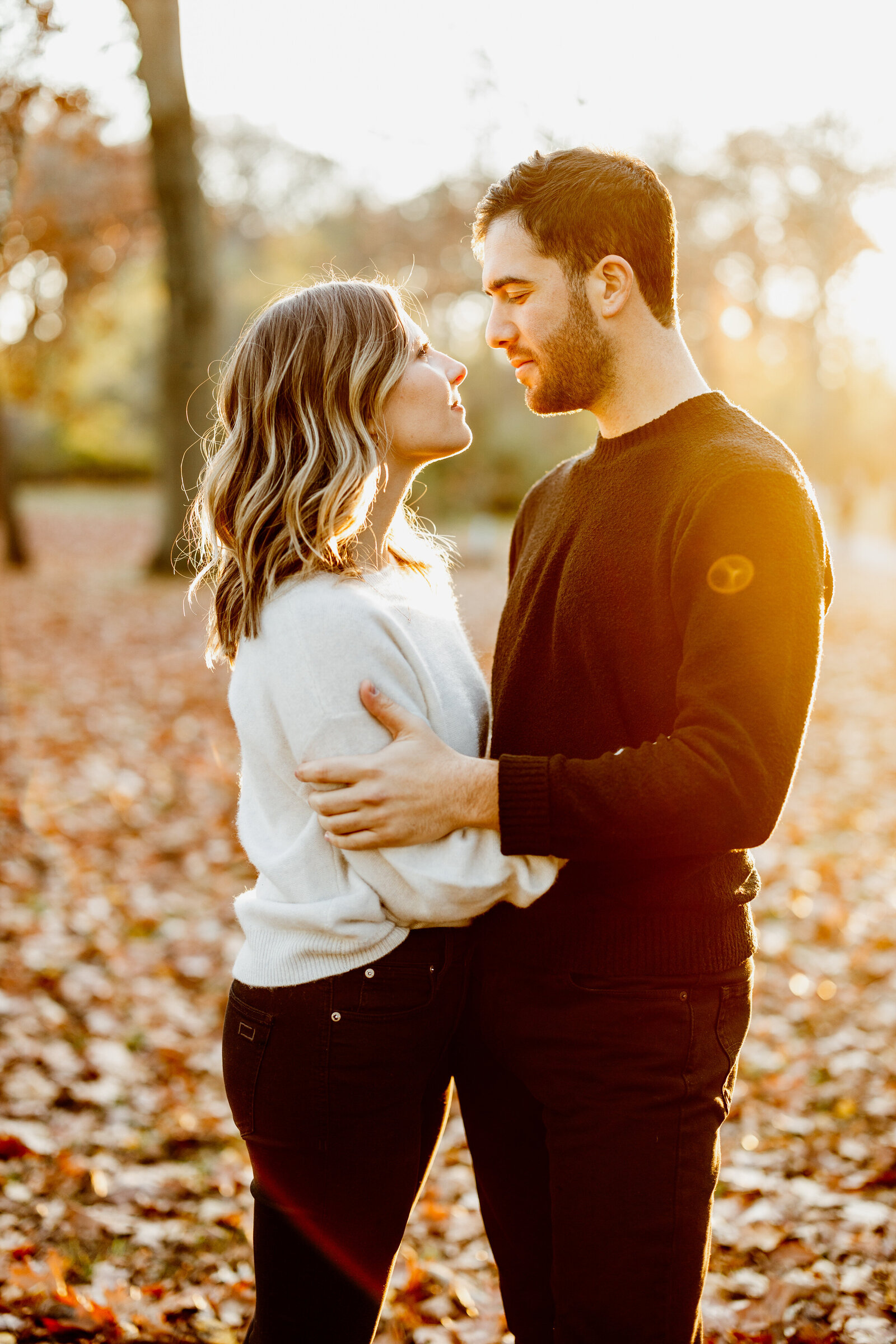 couple in colorful fall leaves