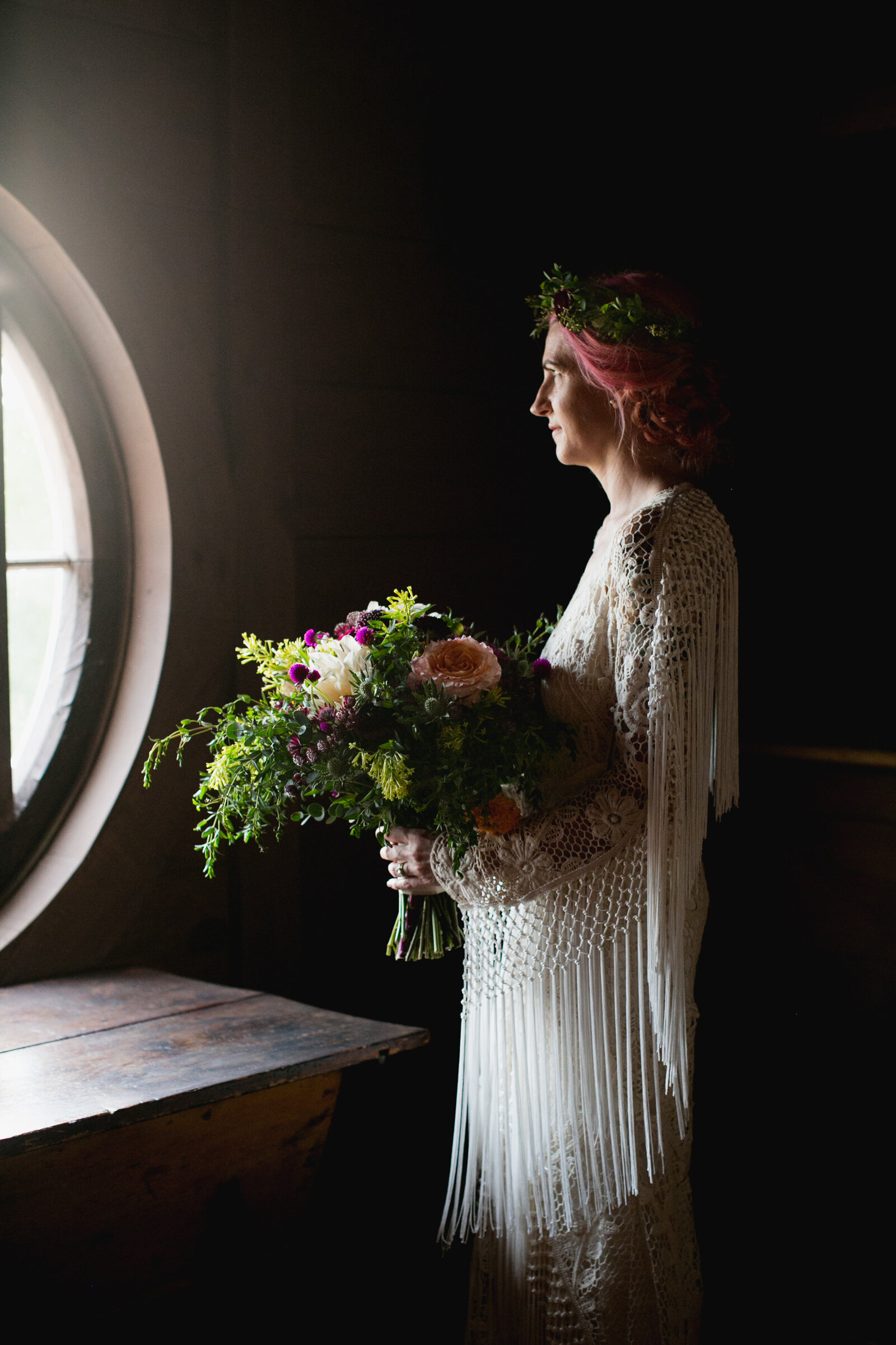 bride with fringe dress at window light