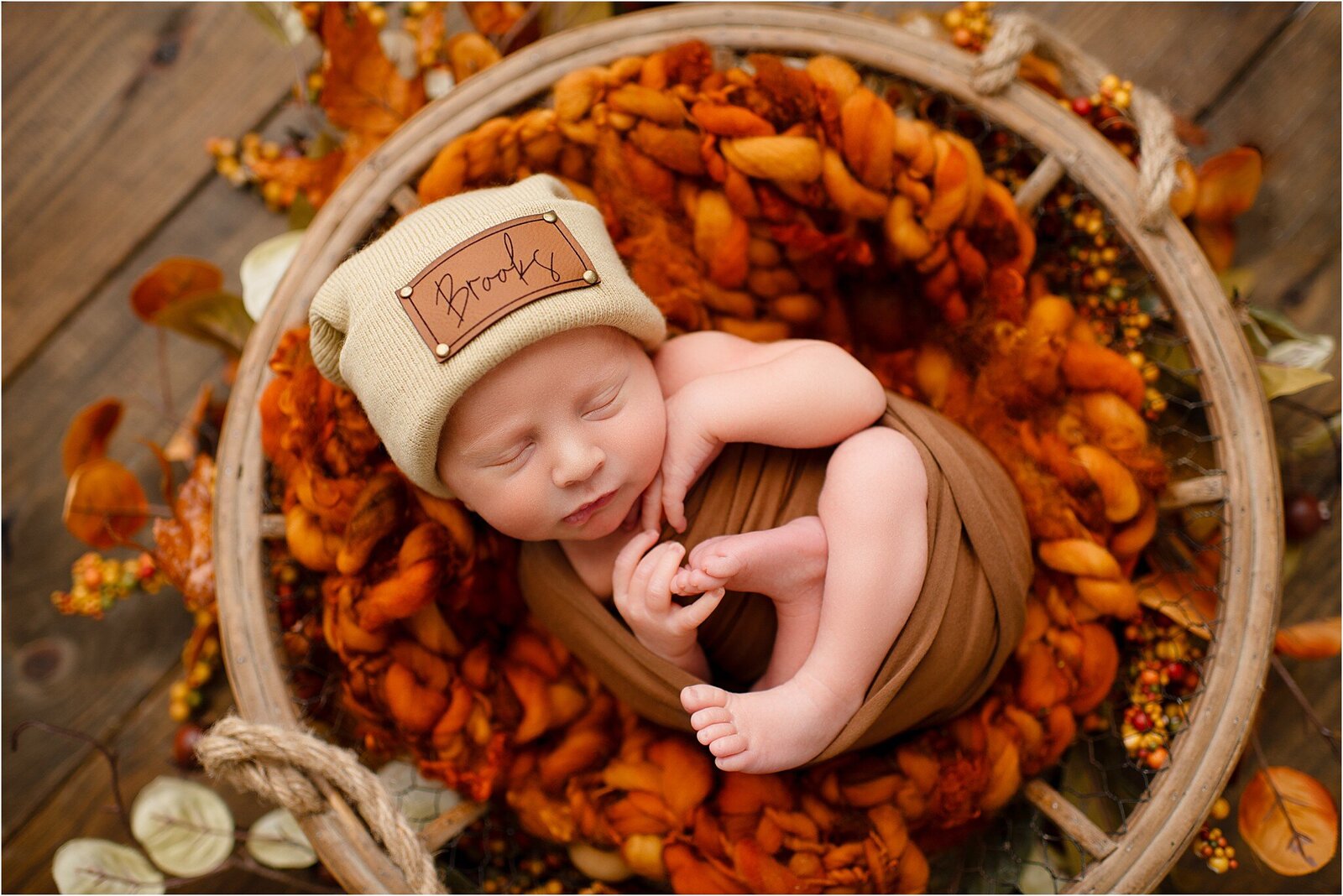 newborn baby in fall colors