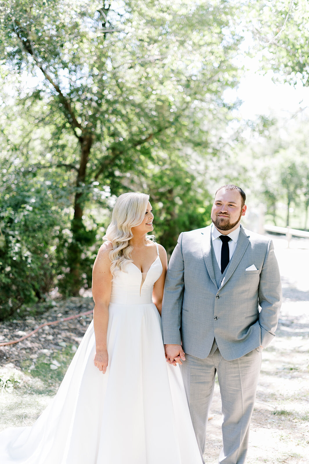 Light and airy photo of bride and groom posing, taken by the Best Boise Wedding Photographers