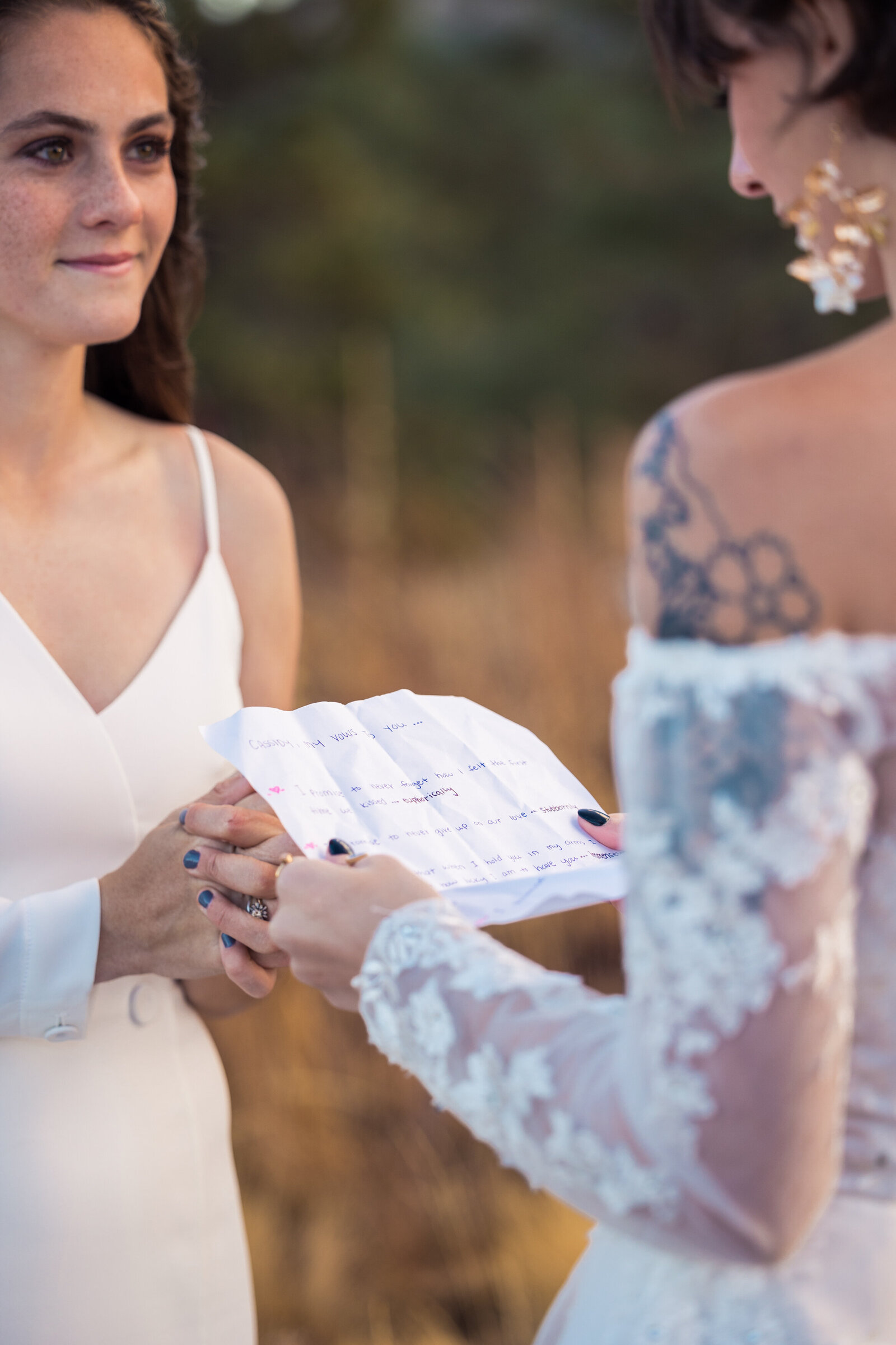hand written vows being read during a wedding ceremony