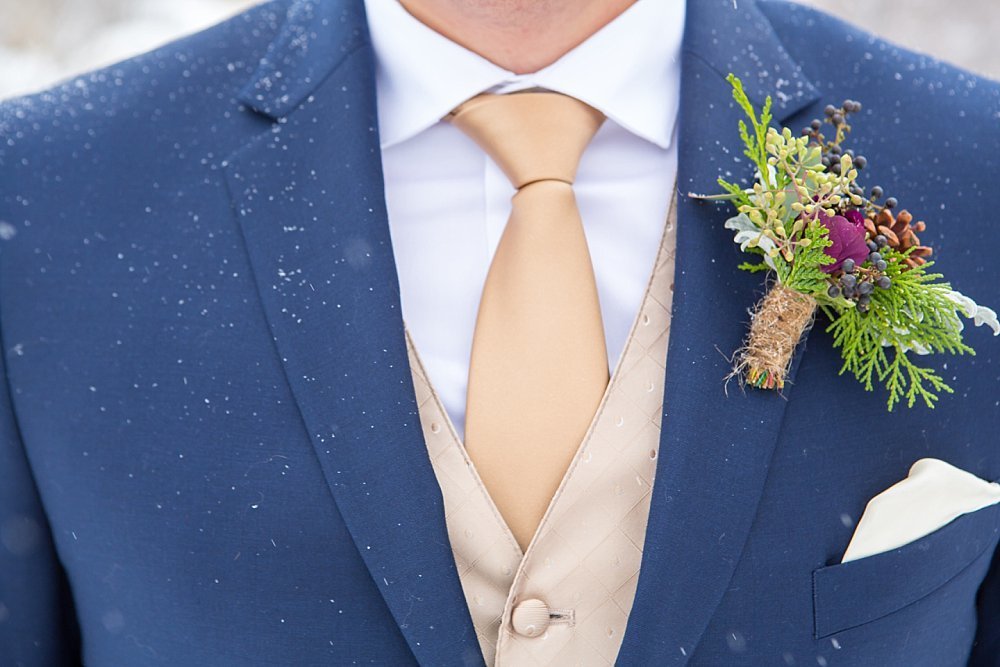 Groom detail with snow