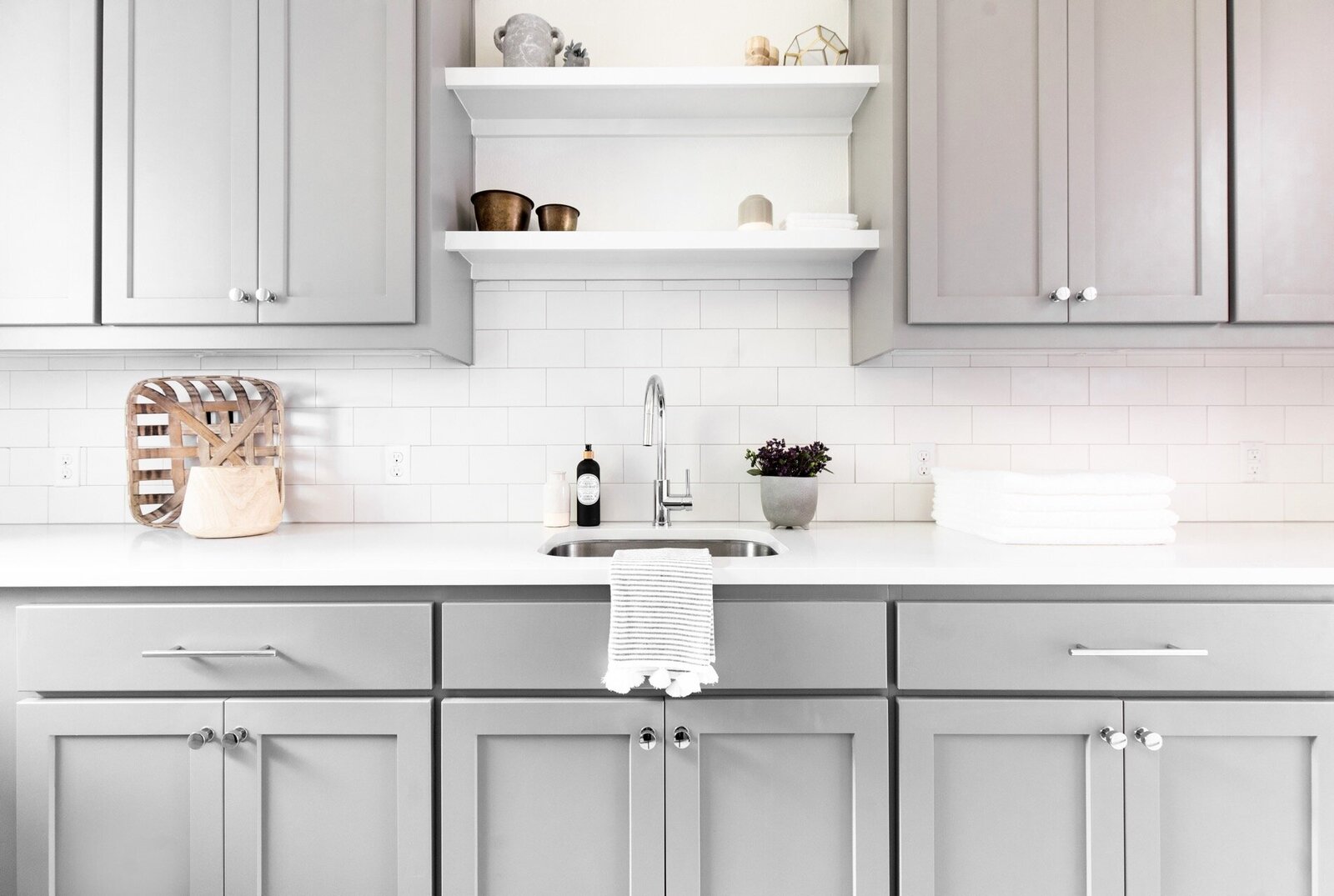 Nuela Designs Laundry White subway tile gray cabinets