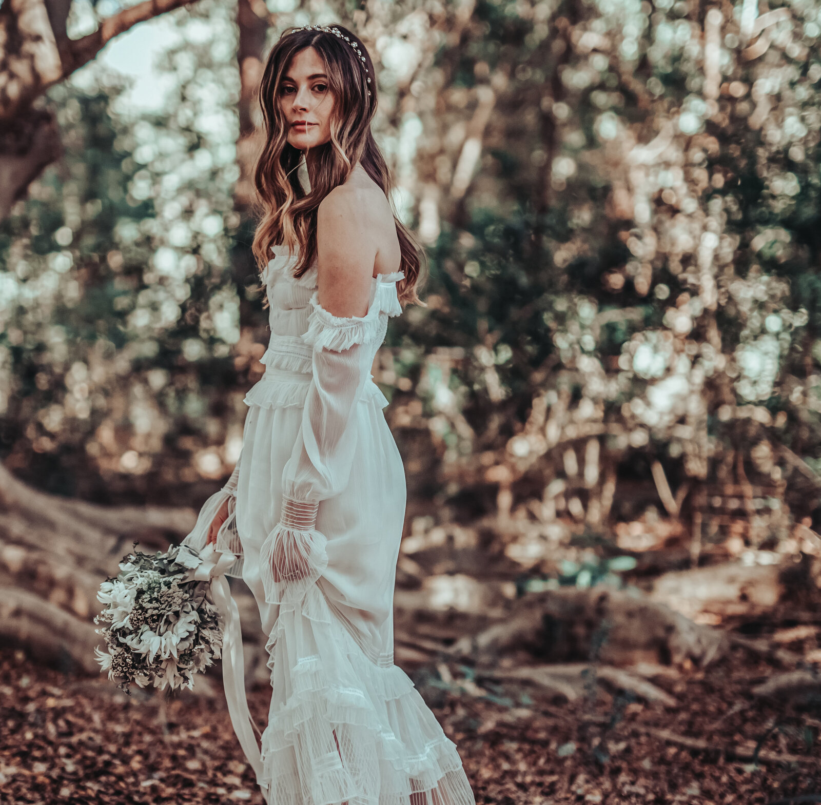Bride posing with wedding flower in the jungle