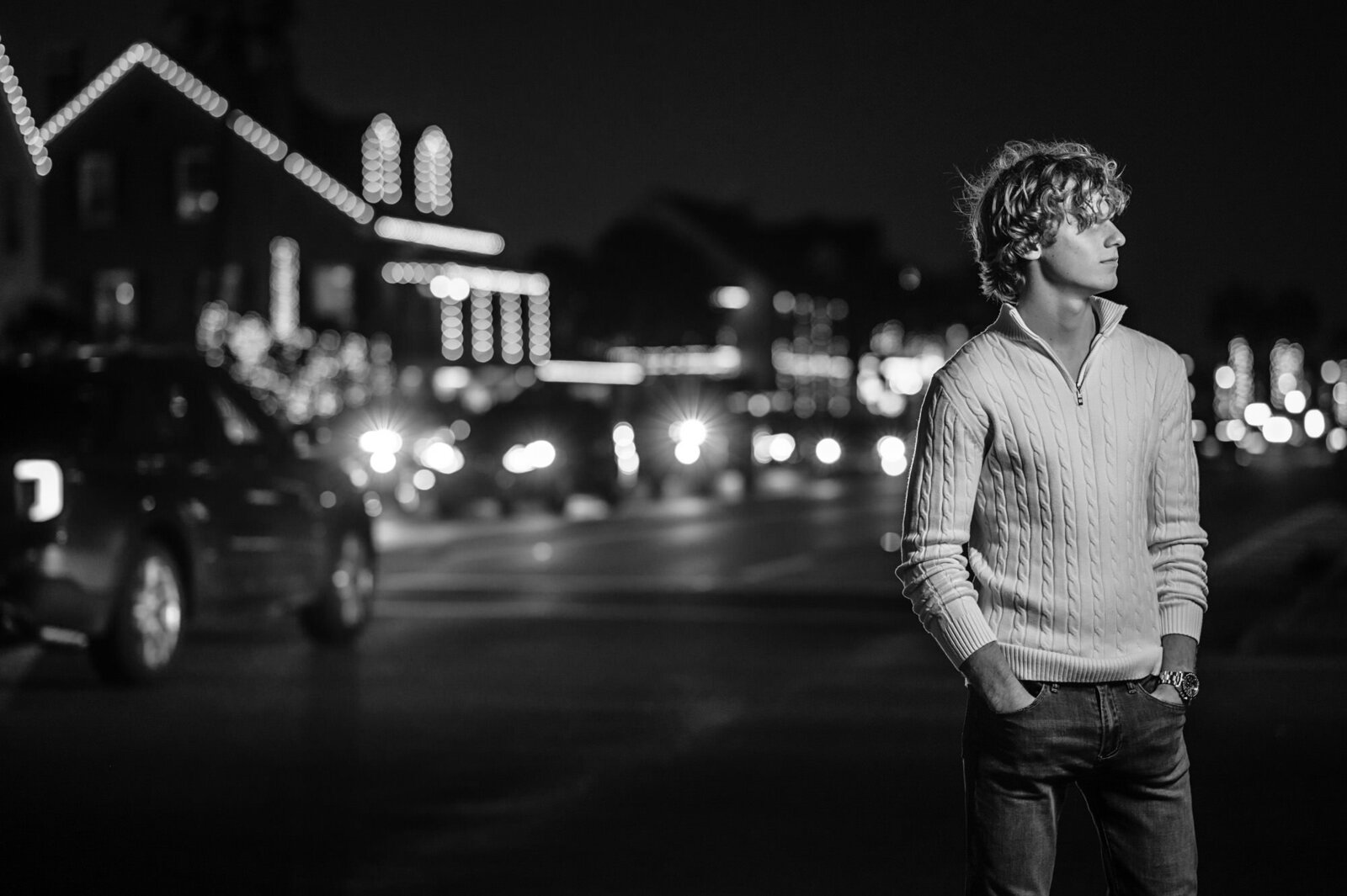 Downtown St. Augustine senior picture with lights at dark
