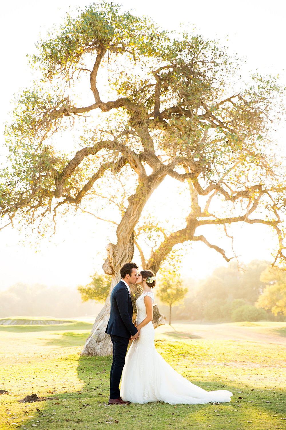 beautiful light with bride and groom at carlton oaks country club with tree