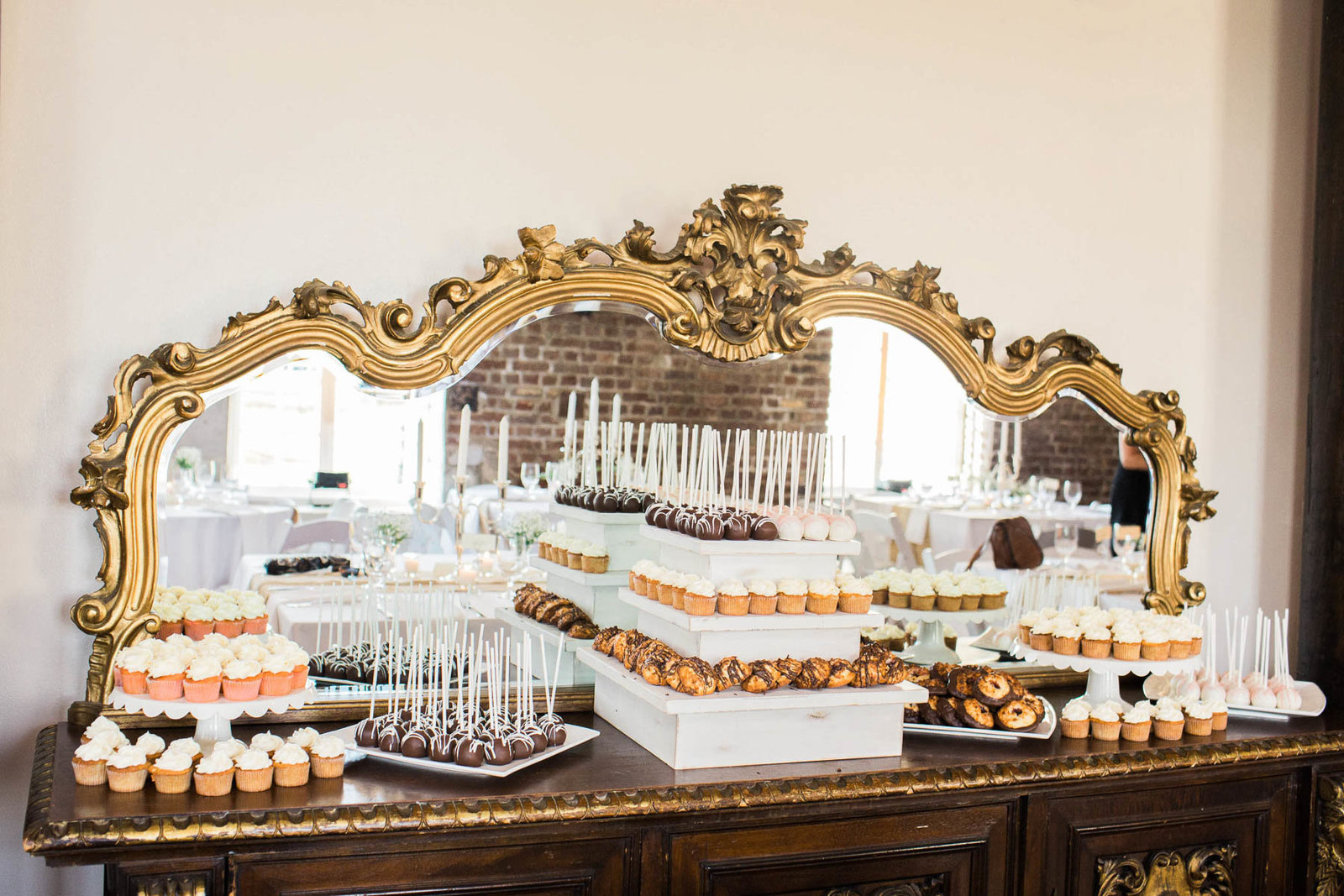 Baked goods are laid out on dessert table, Rice Mill Building, Charleston, South Carolina