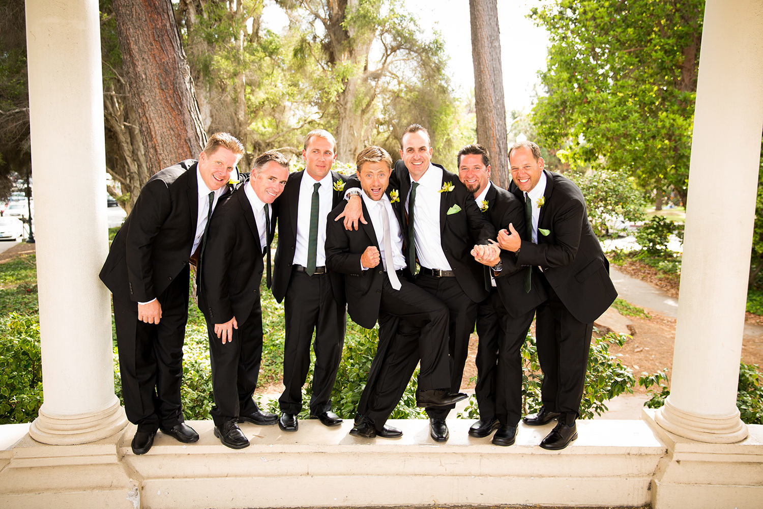 groom being funny with groomsman