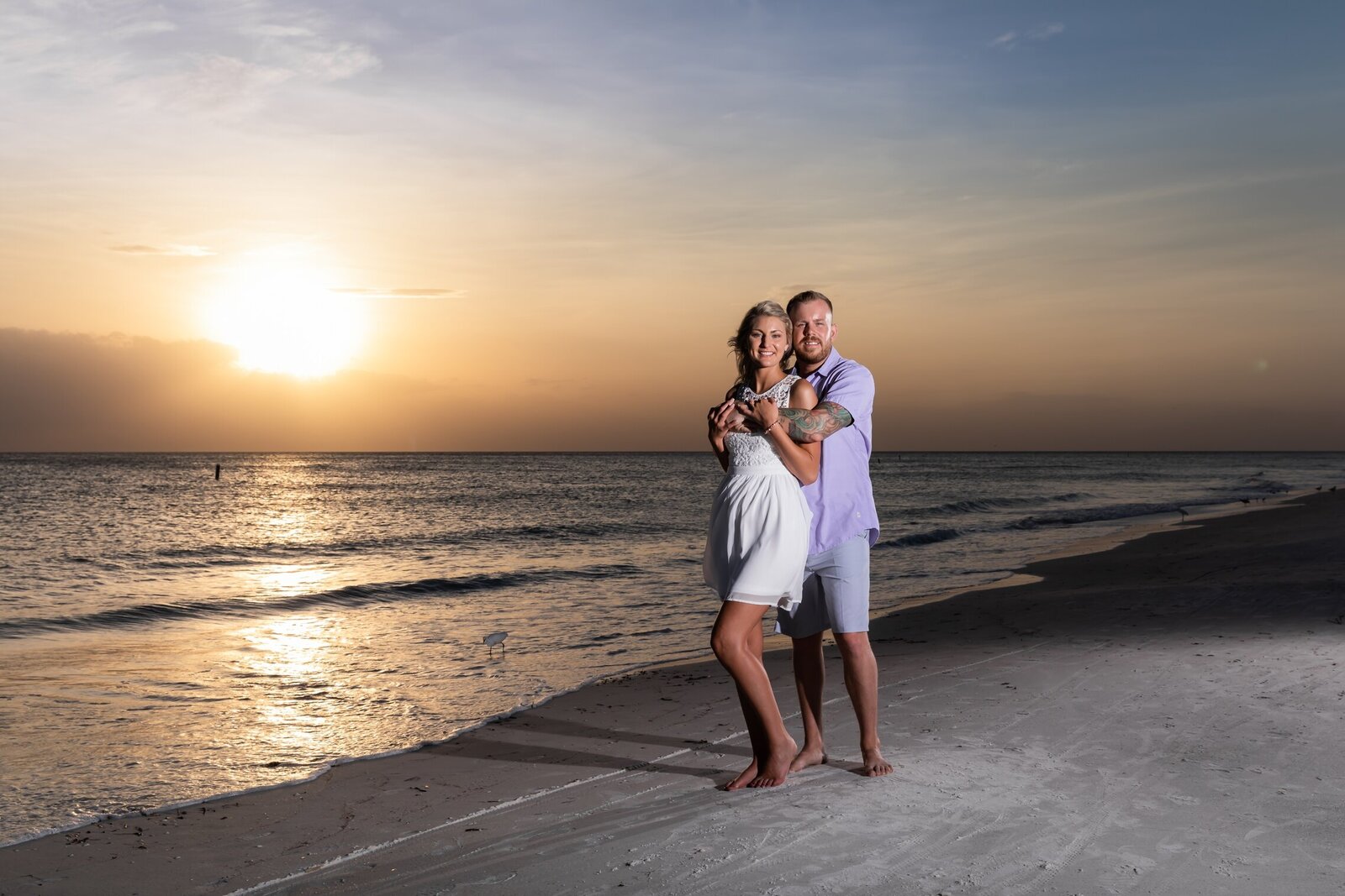 Couple hugging during an engagement shoot on Anna Maria Island
