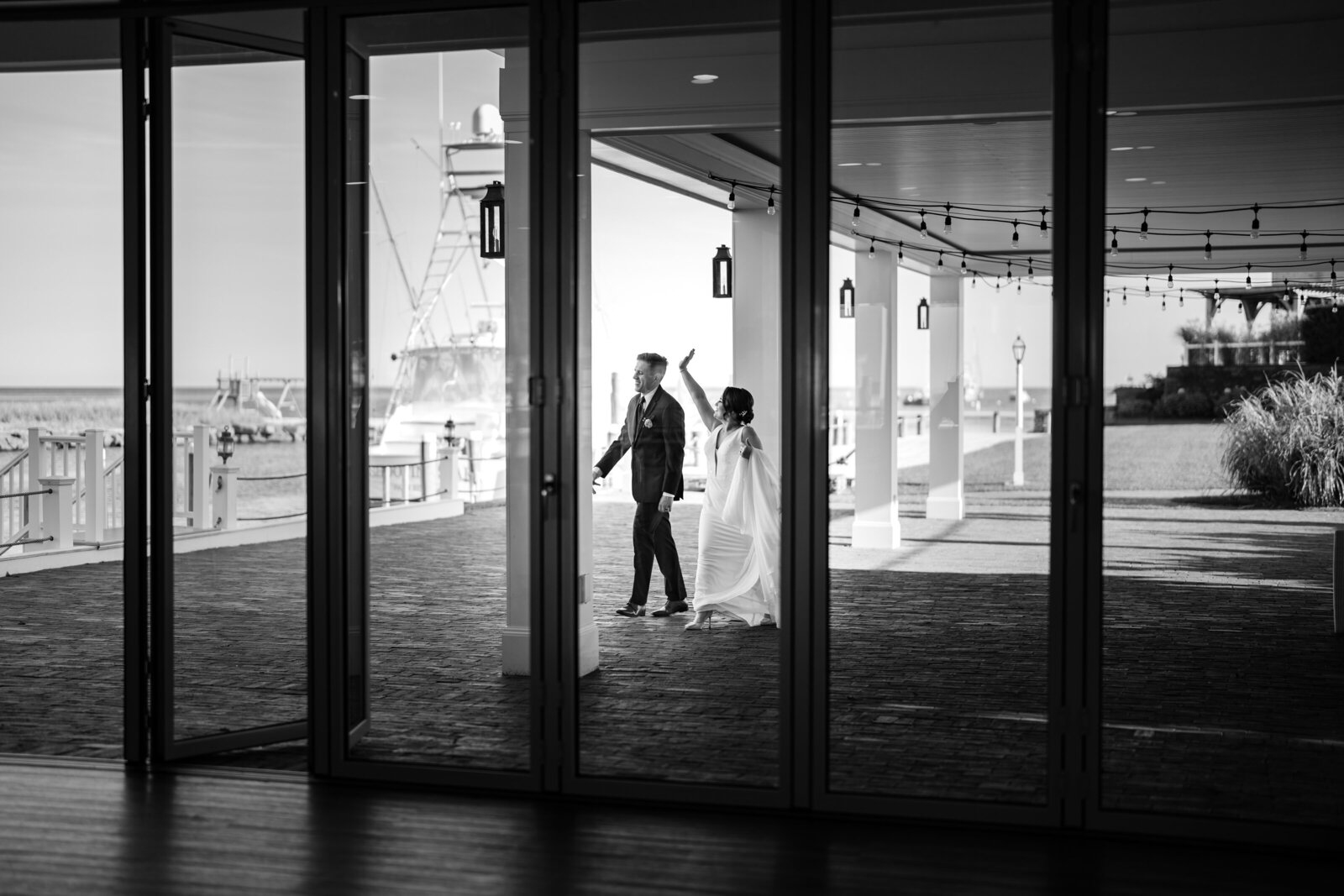 view of bride and groom through glass windows