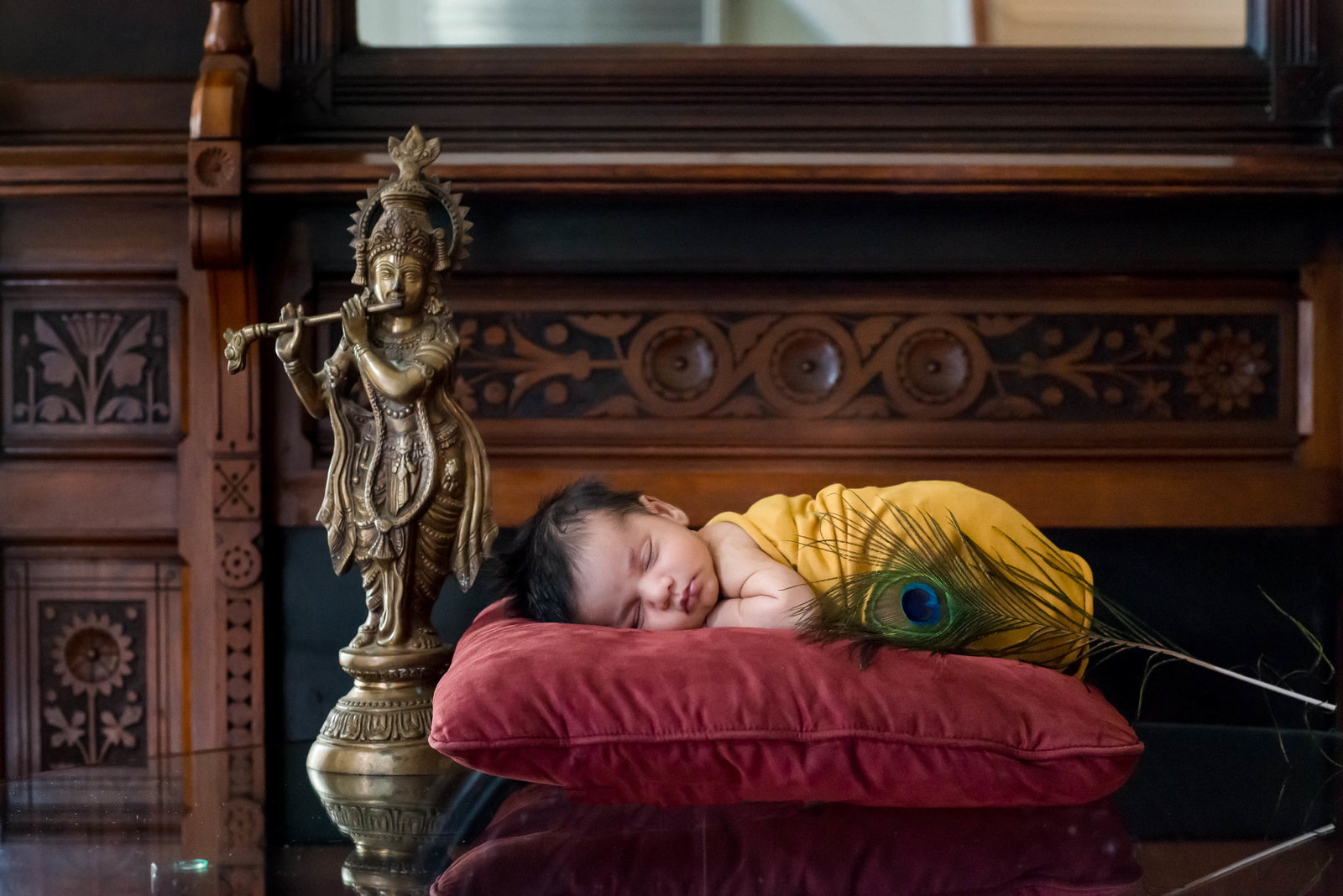 Newborn posed at home on furniture in lifestyle session Boston