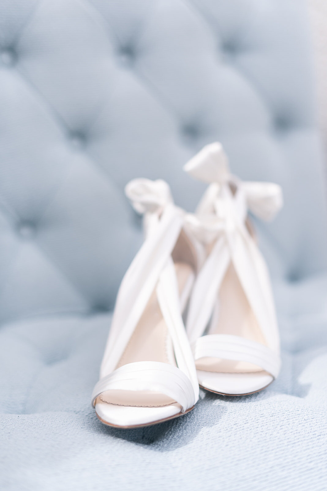 Bella Belle wedding shoes on french blue chair at Cottage at Riverbend Wedding by the Best Boise Wedding Photographers