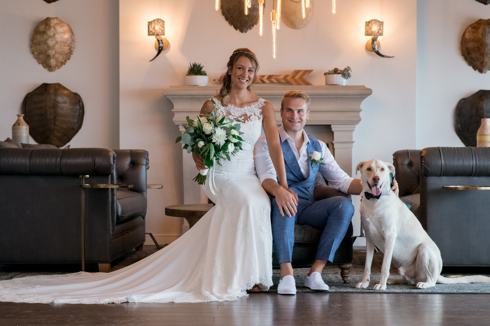 photo of bride and groom with dog inside Gurneys Montauk Resort wedding