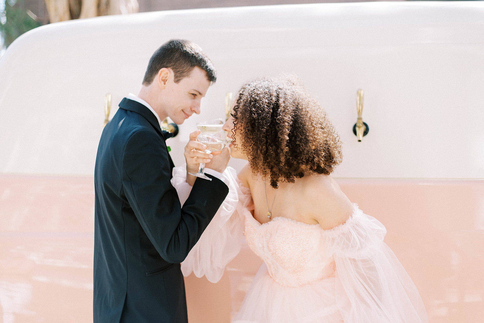 bride and groom holding hands during outdoor bridals