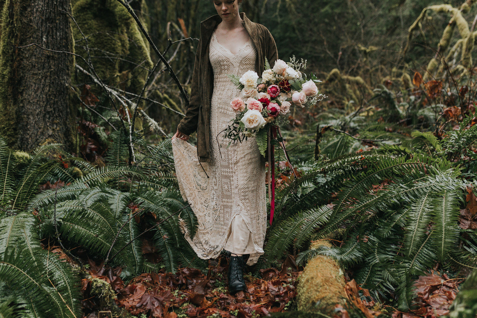 boho bride walking through forest in Washington