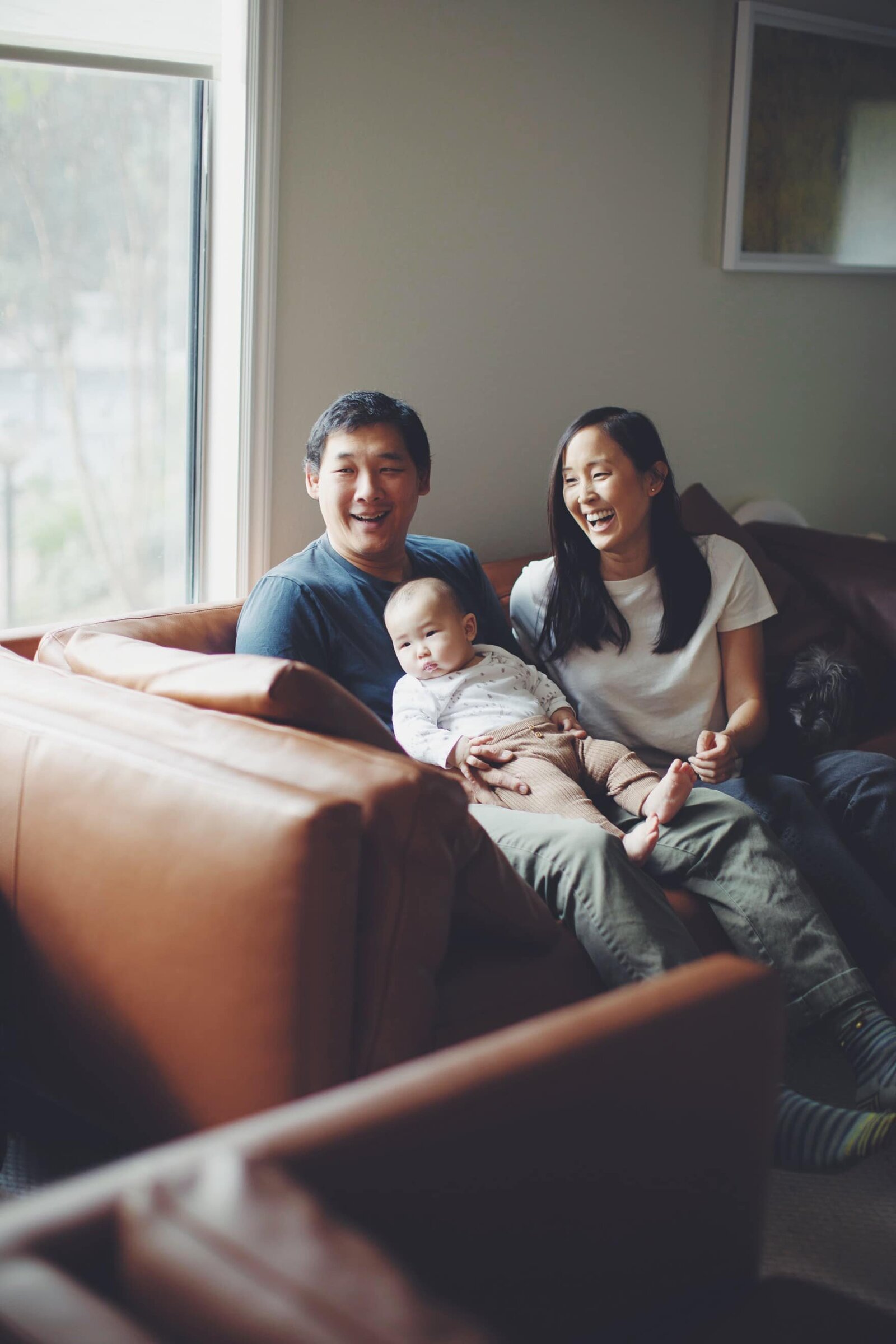 family-laughing-in-home-lifestyle-photographer-denver