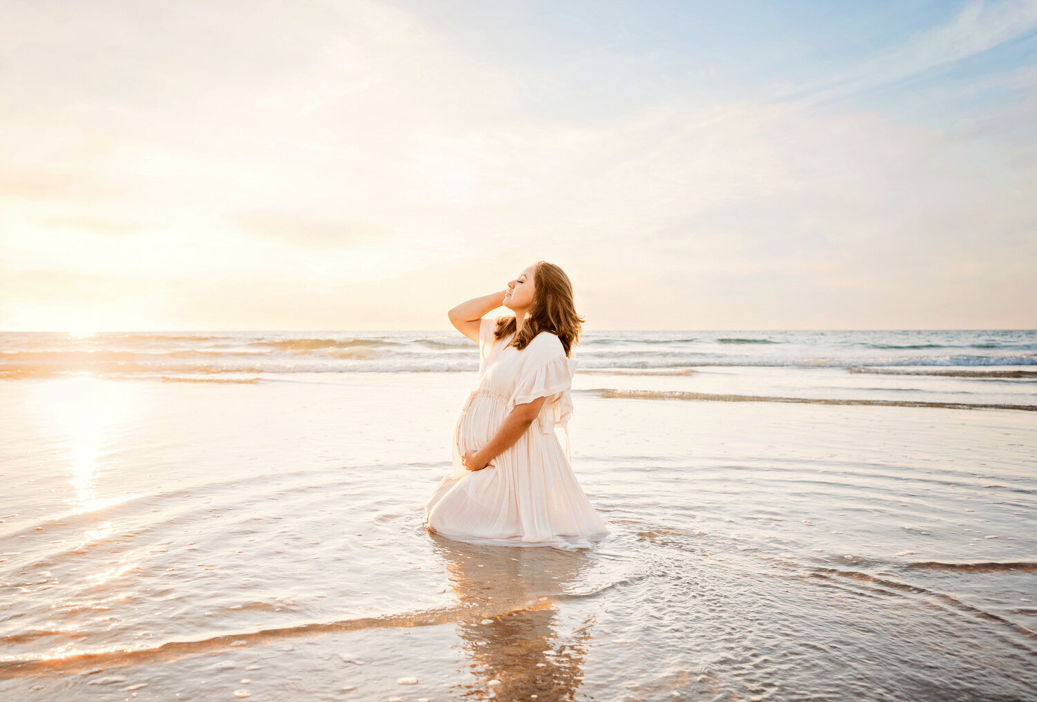 maternity photo on beach by San Diego family photographer Tristan Quigley