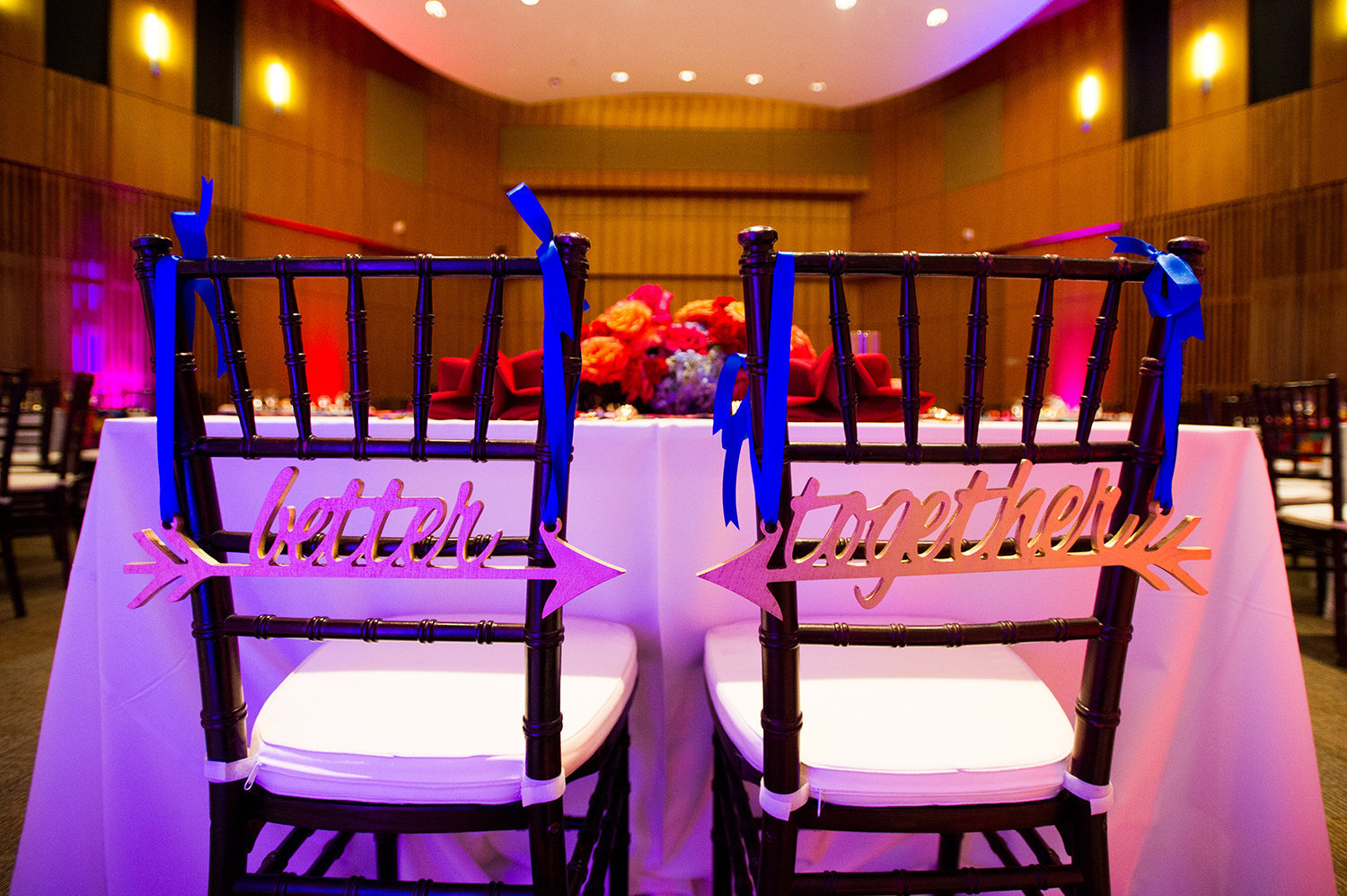 Cute chair signs for the bride and groom at an Indian wedding reception