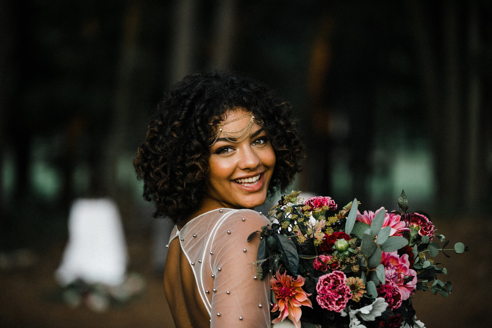 Bride Holds Bouquet and smiles