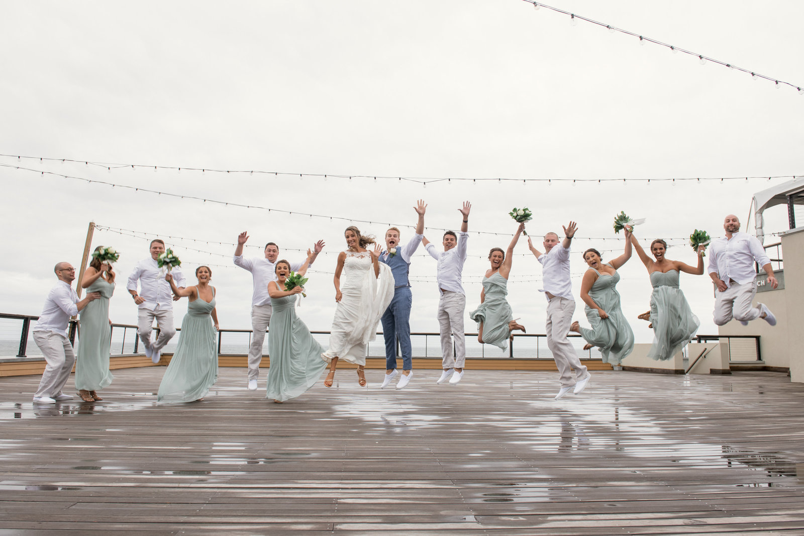 photo of bridal party jumping with bride and groom Gurneys Montauk Resort wedding
