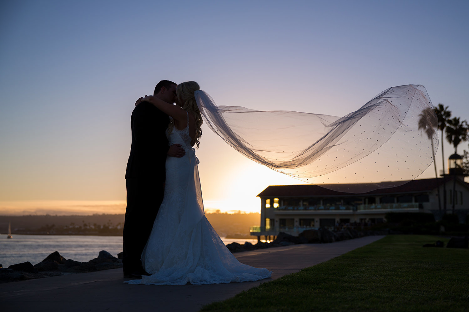 bride and groom with sunset beautiful veil