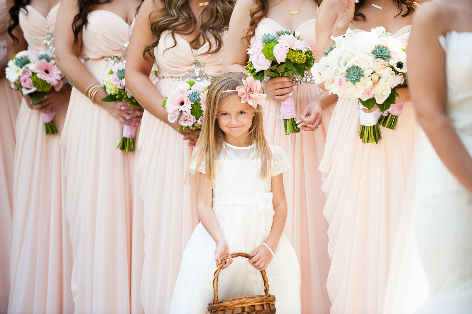Sweet moment captured of the flower girl during the wedding ceremony