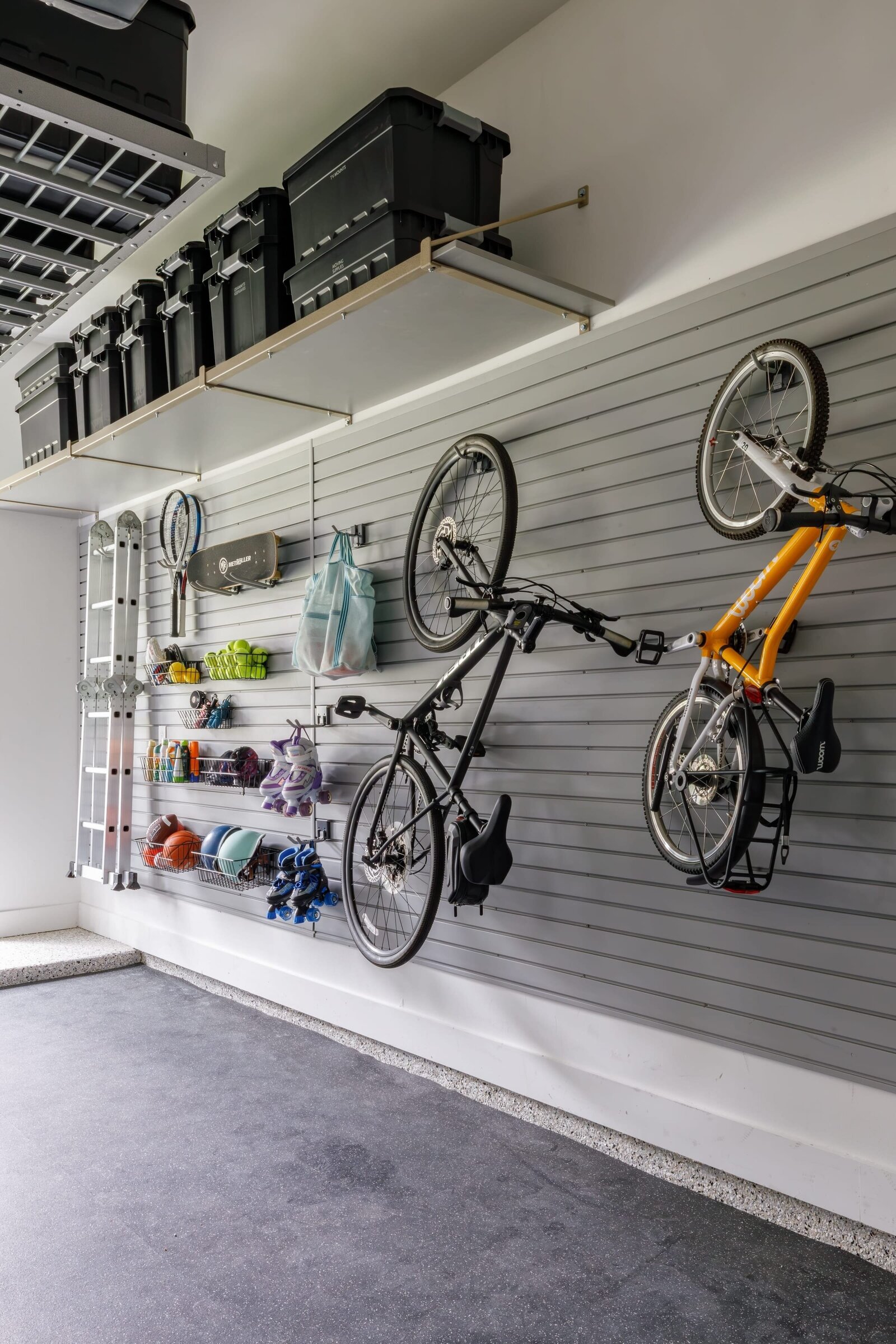 vision and hammer garage with hanging bikes on wall