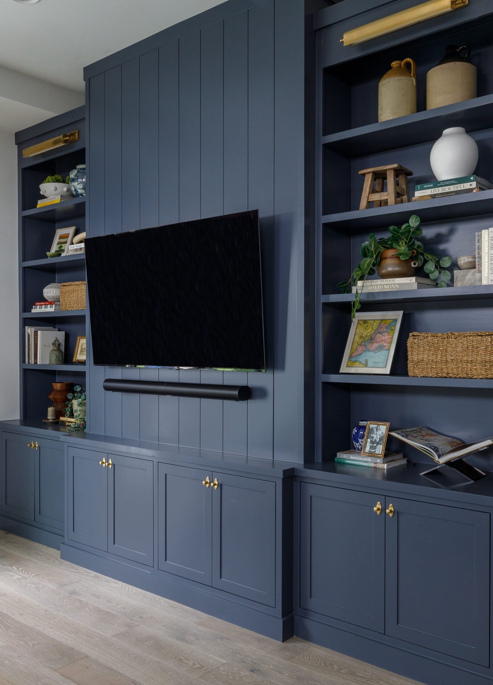 vision and hammer styling shelf on dark blue entertainment center