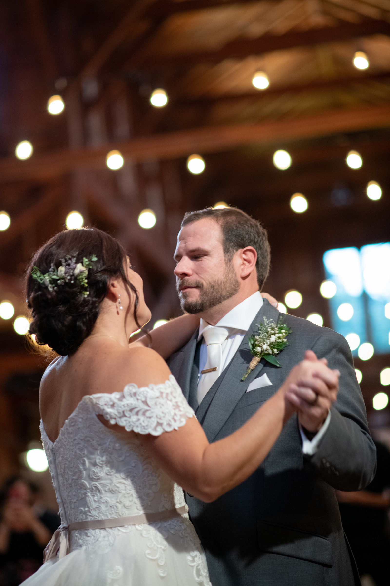groom looking into brides eyes while dancing at The Barn at Old Bethpage
