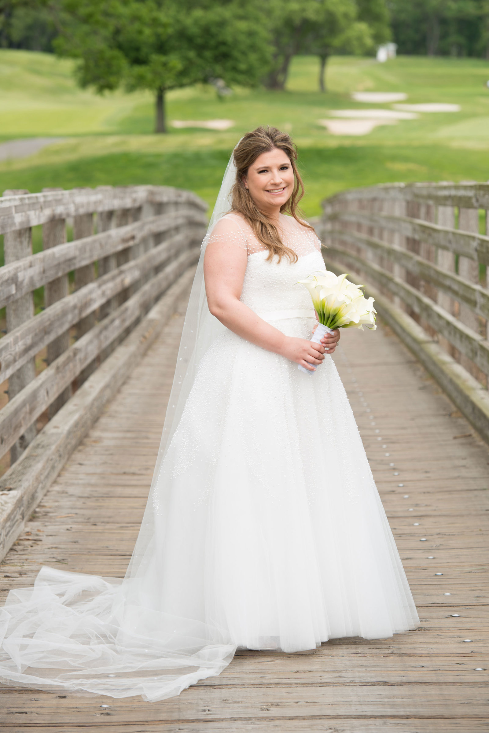 beautiful bride on the bridge at Engineers Country Club