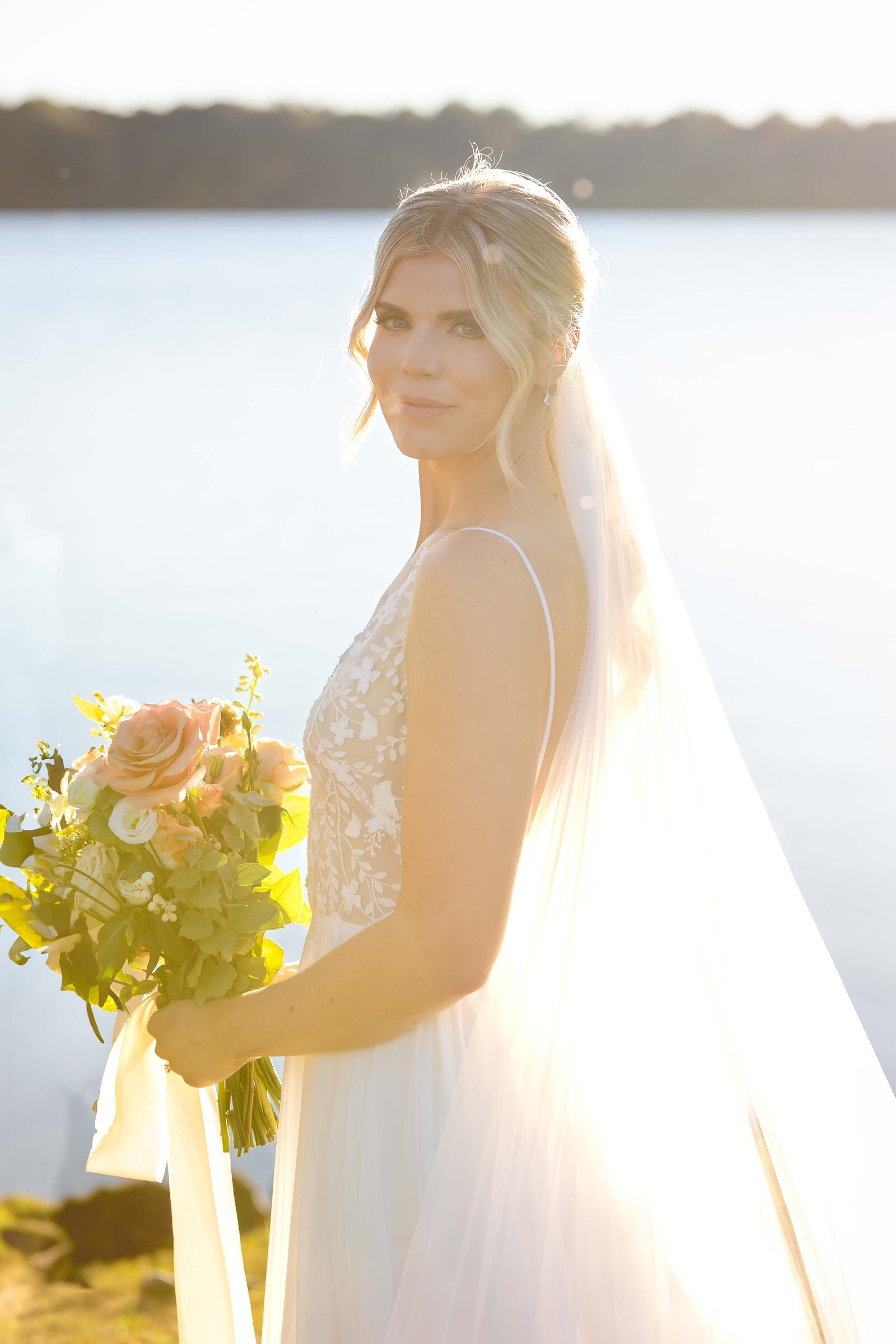 Golden hour portraits of bride at lakeside