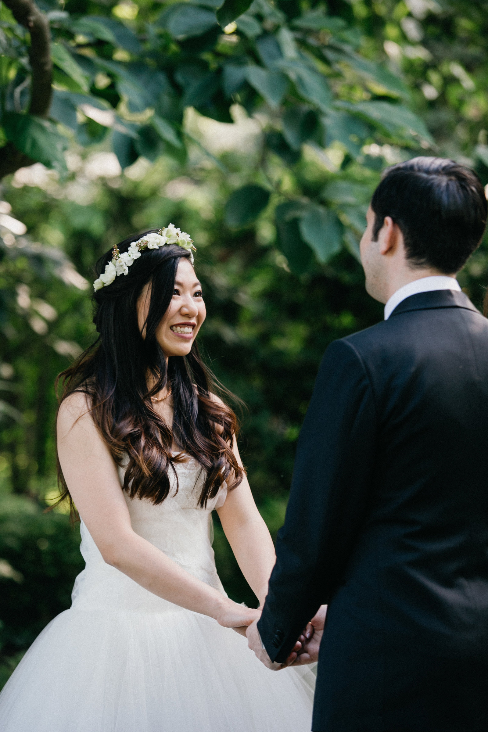 Bride can't stop smiling during the ceremony at this Fernbrook Farm wedding venue.