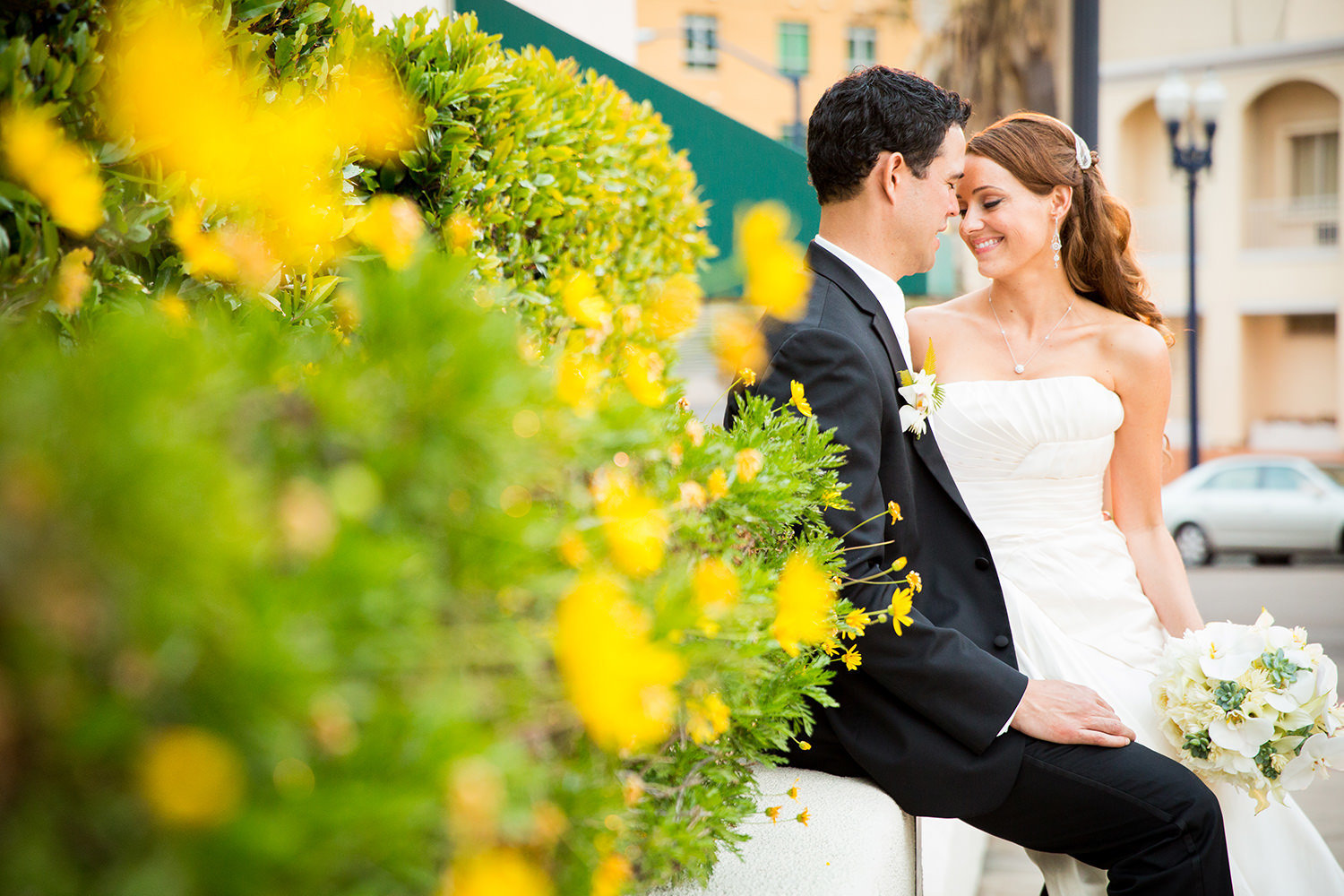 couple in front of the el cortez with beautiful flowers