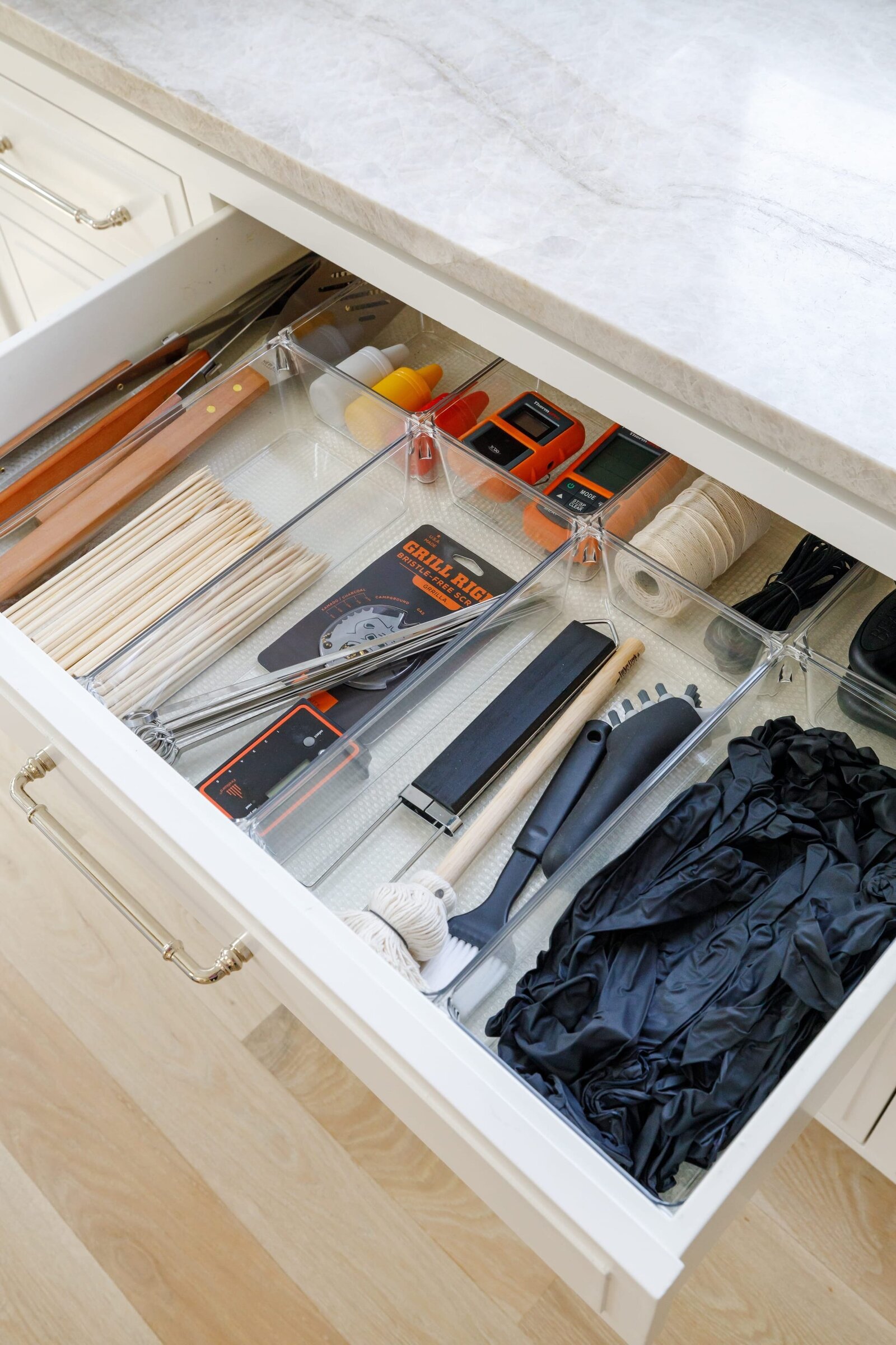 vision and hammer organizing drawer with grilling utensils and cooking gloves