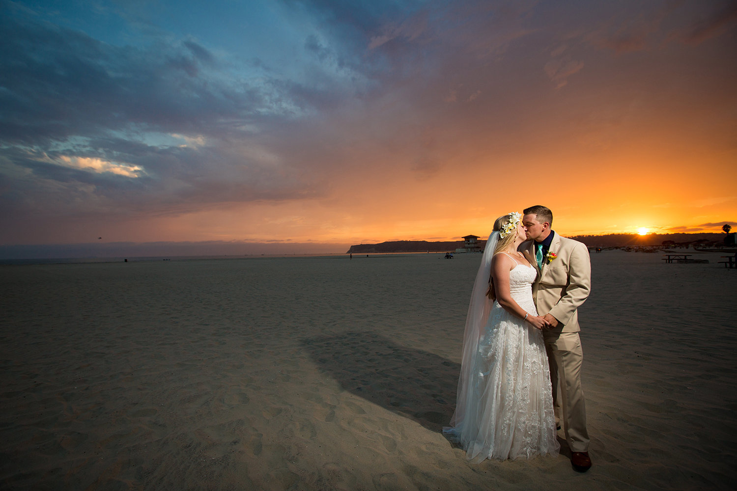 bride and groom at sunset on beach breakers beach