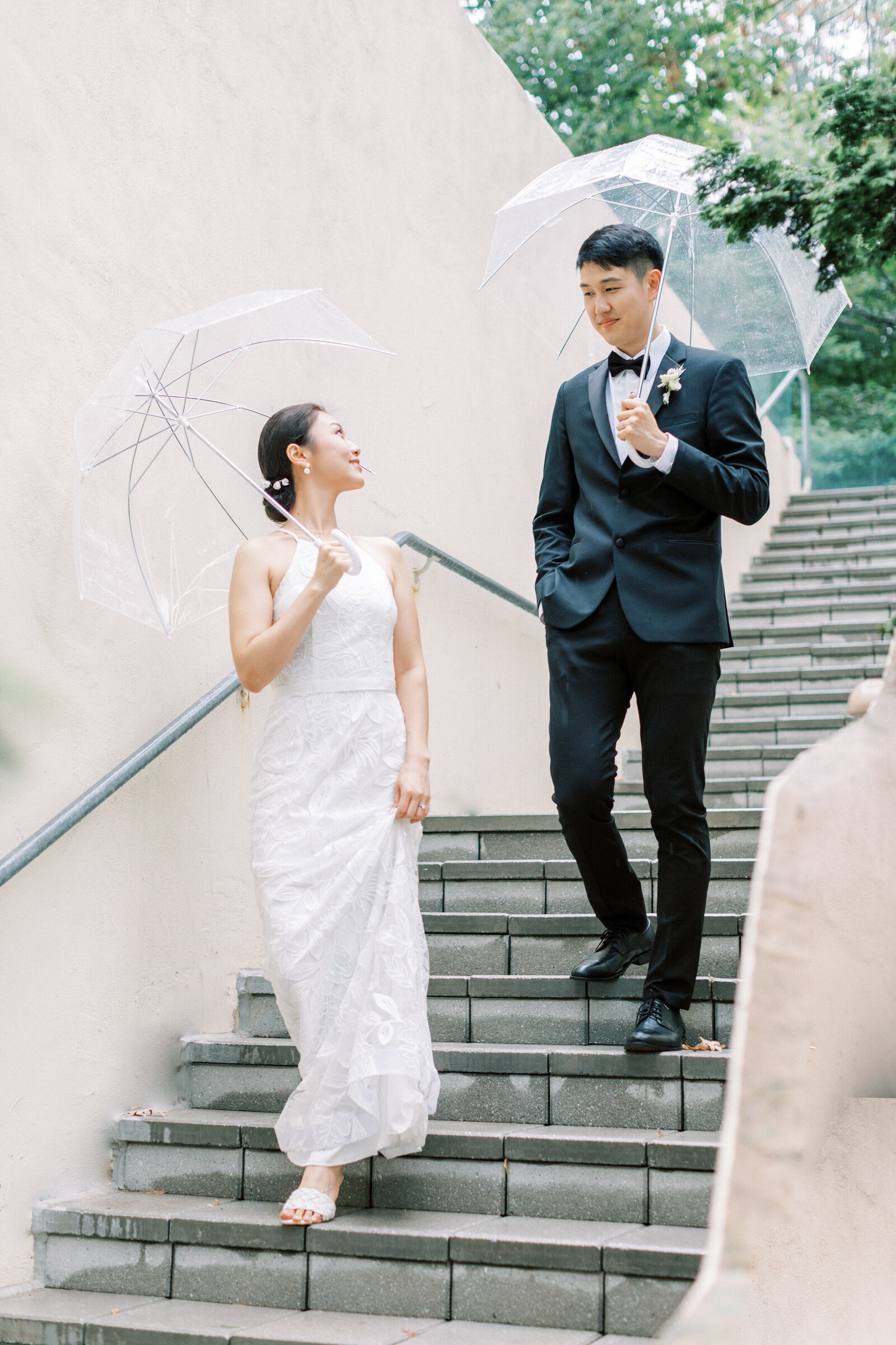 Wedding couples walk down the stairs together